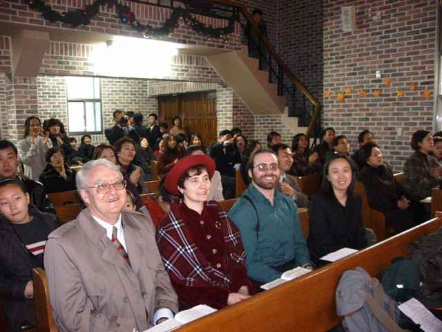 Visiting Sandra's alumnus Yura Han at her Church for Christmas eve service. Listed from right to left, Ron, Sandra, Phillip and Yura.